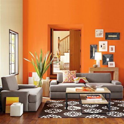 salas com sofá cinza parede laranja