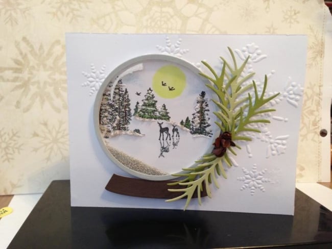 cartão de natal com globo de neve