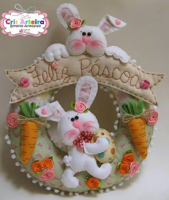 guirlanda decorada com coelhos para páscoa