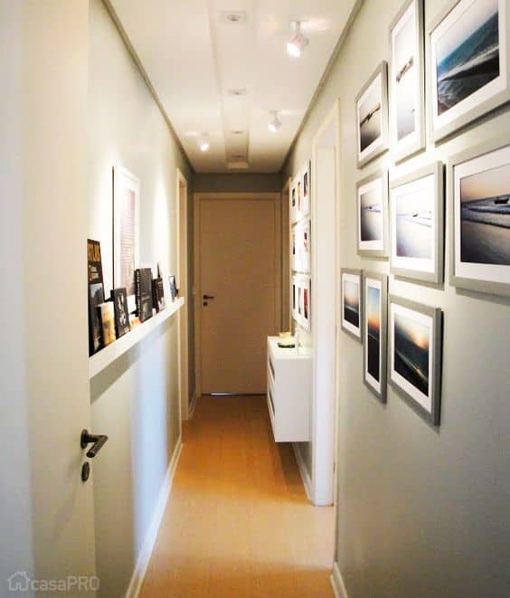 15 corredor decorado com quadros de paisagem Casa Abril